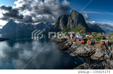 Picturesque Coastal Village Hamnoy With Red Rorbuer Huts On Lofoten Islands In Norway 135025173
