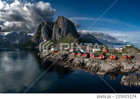 Picturesque Coastal Village Hamnoy With Red Rorbuer Huts On Lofoten Islands In Norway 135025174
