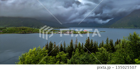 Rural Landscape With Remote Village, Calm Fjord And Foggy Mountains On Lofoten Islands In Norway 135025507