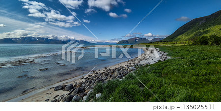 Coastal Landscape With White Sand Beach And Snowy Mountains At Fjord On Lofoten In Norway 135025511