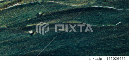 Dark Green Metallic Surface with Golden Streaks and Flowing Lines Abstract Texture 135026483