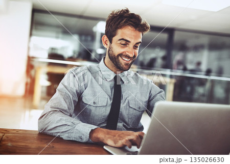 Happy businessman, laptop and typing email for communication, schedule or networking at office. Male person or employee working with smile on computer in project or social media browsing at workplace 135026630