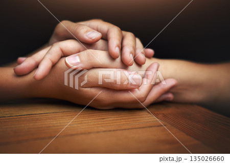 Closeup, love and holding hands for support, comfort and care with grief, loss and empathy. Zoom, people and friends with compassion, sympathy and healing with bonding, hope and trust with crisis 135026660