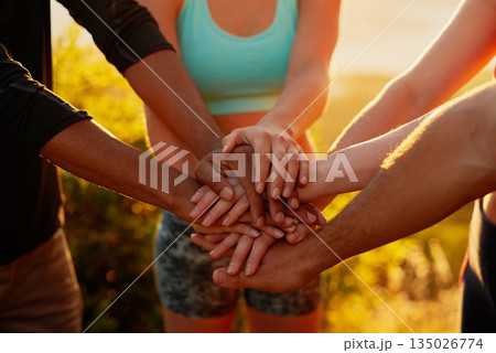 Hands together, fitness friends and outdoor with motivation, workout and teamwork in nature. Exercise, sport and people with hand in sign for support, training and motivation with solidarity and sun 135026774