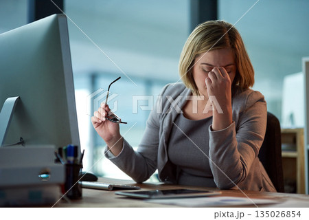 Stress, headache and business woman in office, tired or fatigue while working late at night on computer. Burnout, migraine and female person with depression, anxiety or brain fog, pain and sick. 135026854