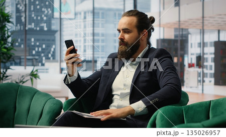 Outraged business director criticizing incompetent staff on a video call, displeased with the paperwork for the enterprise. Rude furious CEO screaming at people, bad leadership. Camera B. Outraged business director criticizing incompetent staff on a video call, displeased with the paperwork for the enterprise. Rude furious CEO screaming at people, bad leadership. Camera B. 135026957