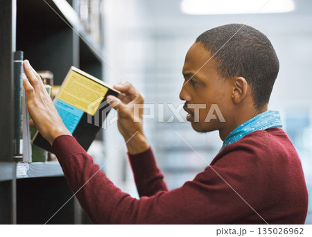 Education, university and student in the library picking a book or on shelf for exam preparation and in college. Research, learning and scholar browsing journal or academic and educational course Education, university and student in the library picking a book or on shelf for exam preparation and in college. Research, learning and scholar browsing journal or academic and educational course 135026962