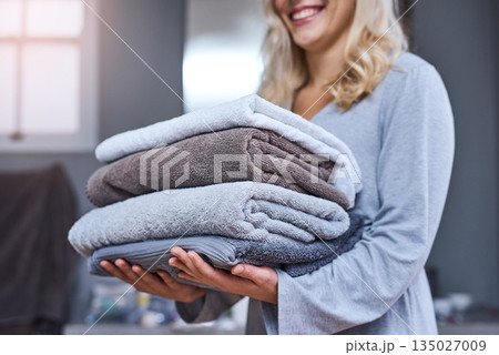 Laundry, cleaning and a woman carrying a pile of towels in her home for hygiene or a spring clean day. Chore, service and a female cleaner with a stack of fresh or clean fabric in a hotel room Laundry, cleaning and a woman carrying a pile of towels in her home for hygiene or a spring clean day. Chore, service and a female cleaner with a stack of fresh or clean fabric in a hotel room 135027009