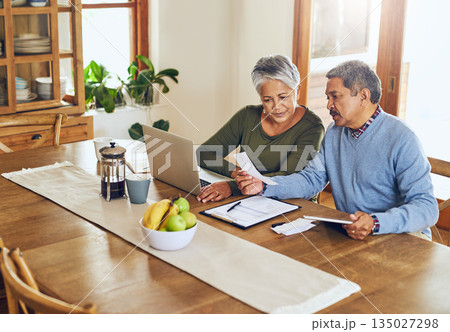 Finance, laptop and senior couple with bills, paperwork and receipt documents for life insurance. Retirement, fintech and elderly man and woman on computer for mortgage payment, investment and budget 135027298