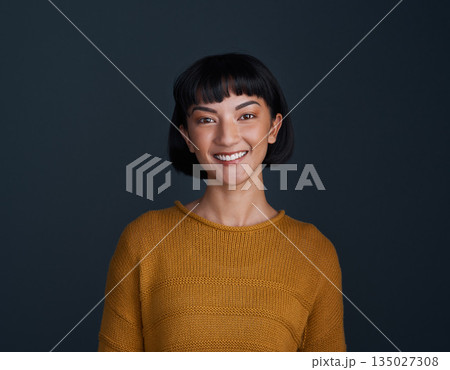 Woman with smile in portrait, happy and confident with young person isolated on blue background. Youth, gen z and female model in studio with mockup space, positive mindset and happiness 135027308