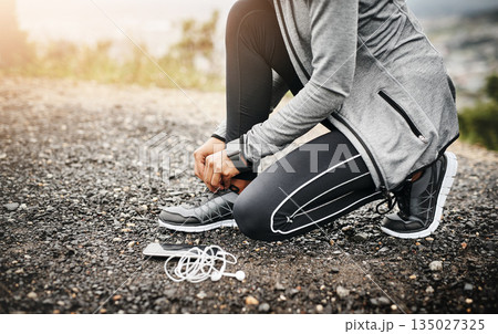 Closeup, headphones and woman tie shoes, fitness and healthy with runner outdoor, wellness and training. Female person, athlete and girl with technology, hands and practice to start running and laces Closeup, headphones and woman tie shoes, fitness and healthy with runner outdoor, wellness and training. Female person, athlete and girl with technology, hands and practice to start running and laces 135027325