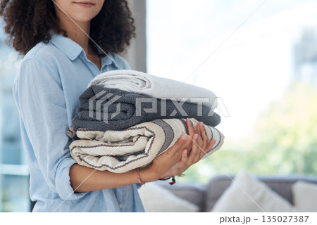 Clean laundry, holding and hands with towels from the wash for the house and fresh linen. Cleaner, organize and a woman with clothes in an apartment, packing and organizing clothing for routine 135027387