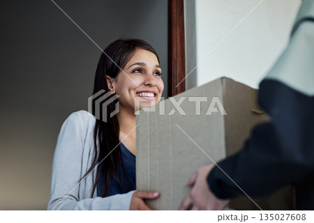 Happy, woman and courier with a package, delivery and distribution with a box, supply chain and ecommerce. Female person, customer and client with employee, worker and shipping with parcel and order 135027608