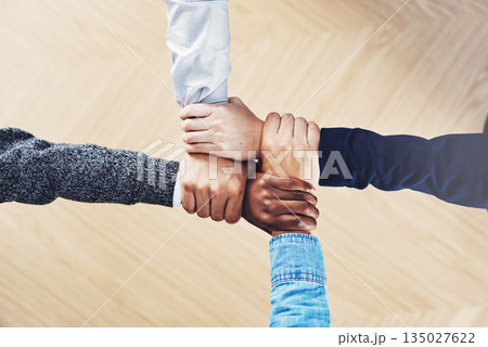 Team building, link or hands of business people with diversity for community support or teamwork in office. Zoom, above or group of employees with joint mission, trust or hope for goals together 135027622