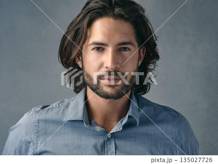 Portrait, confident and business man with long hair, beard on gray studio background. Face, businessman and model with professional focus of entrepreneur, manager or casual corporate worker Portrait, confident and business man with long hair, beard on gray studio background. Face, businessman and model with professional focus of entrepreneur, manager or casual corporate worker 135027726