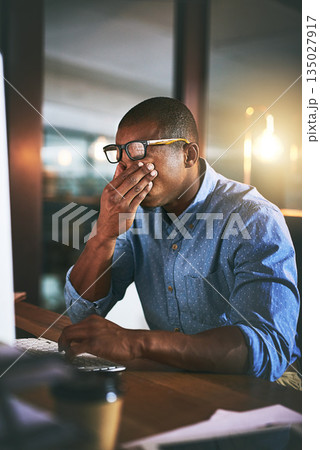African business man, tired and fatigue in night, office and headache by computer for project deadline. Black businessman, burnout or stress in workplace by pc, web design startup and mental health 135027917