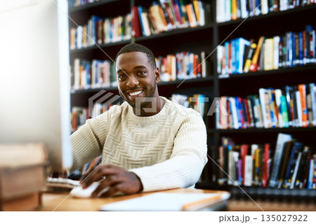 Portrait, education and black man in a library, computer or research for a project, assignment or search website for information. Face, male person or student with technology, knowledge or connection 135027922