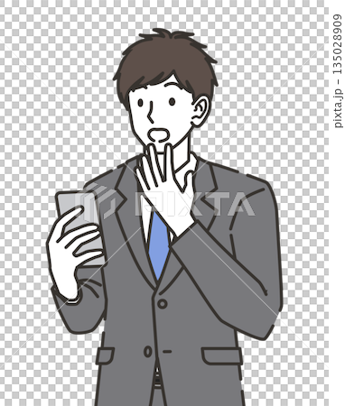 A businessman surprised to see a smartphone A businessman surprised to see a smartphone 135028909