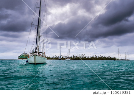 Sailboat at the bay in beautiful Caribbean island in San Blas, Panama, Central America. Sailboat at the bay in beautiful Caribbean island in San Blas, Panama, Central America. 135029381