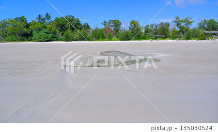 Lone Granite Rock on Wide White Sand Beach of Sungailiat Bangka Island During Low Tide 135030524