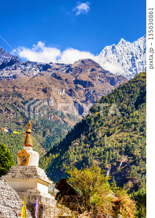 Stupa and the prayer rock and mountains on Everest Base Camp Trek in Nepal. 135030861