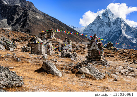 The memorial place on Everest Base Camp trek outside the village of Dughla in Nepal. 135030961