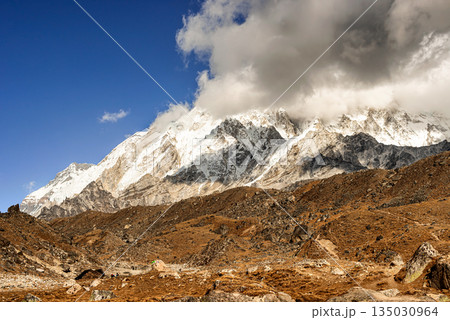 Scenic valley in Himalayan mountains on the trek to Dingboche, Nepal. Scenic valley in Himalayan mountains on the trek to Dingboche, Nepal. 135030964
