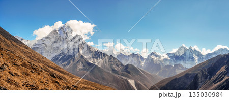 Scenic valley and Himalayan mountains peaks on trek between Tengboche and Lobuche, Nepal. 135030984