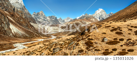 Scenic valley and Himalayan mountains peaks on trek between Tengboche and Lobuche, Nepal. Scenic valley and Himalayan mountains peaks on trek between Tengboche and Lobuche, Nepal. 135031026