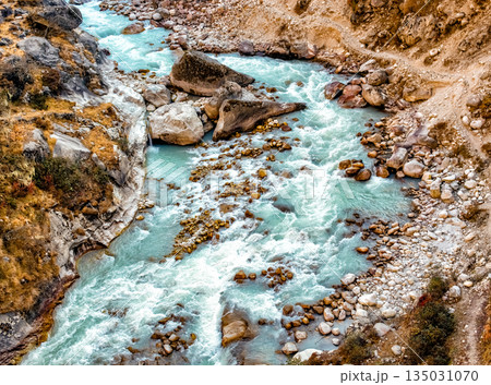 Crossing river in Himalaya on Everest Base Camp Trek in Nepal. Crossing river in Himalaya on Everest Base Camp Trek in Nepal. 135031070