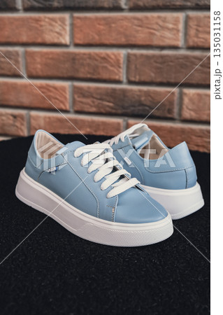 Elegant blue leather womens shoes blank product for branding displayed. New casual female sneakers no-brand footwear e-commerce. No logo product unbranded fashion Elegant blue leather womens shoes blank product for branding displayed. New casual female sneakers no-brand footwear e-commerce. No logo product unbranded fashion 135031158