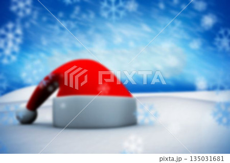 Flat design Santa hat is resting on snowfield with floating snowflakes under blue gradient sky 135031681