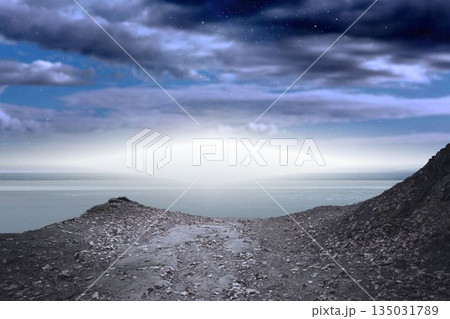 Rocky path is leading through jagged slopes in flat design, showing calm water and cloud layers Rocky path is leading through jagged slopes in flat design, showing calm water and cloud layers 135031789
