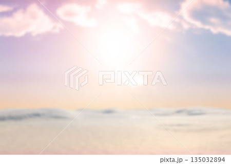 Glowing sun is casting warm pastel light over calm water or dunes in flat design Glowing sun is casting warm pastel light over calm water or dunes in flat design 135032894