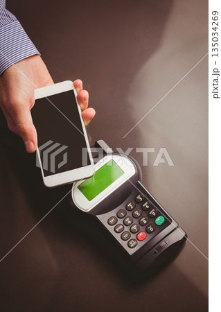 Man using smartphone to express pay 135034269