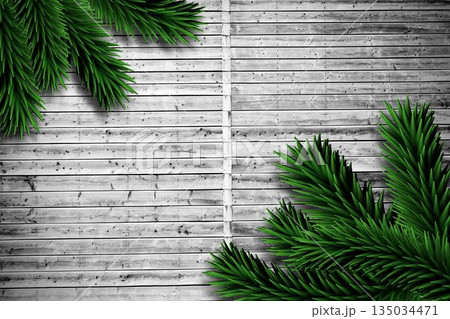 Fir branches on wooden planks Fir branches on wooden planks 135034471