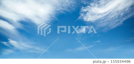 clear blue sky is showing thin wispy clouds in full-frame flat design with open air vibe 135034496