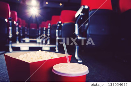 Popcorn box with drink in theater Popcorn box with drink in theater 135034655