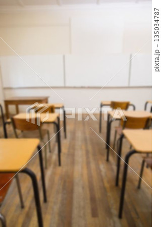 Desk and chairs with whiteboard in classroom 135034787