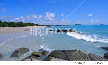 Scenic White Sand Beach and Granite Rocks with Lush Green Trees in Sungailiat Scenic White Sand Beach and Granite Rocks with Lush Green Trees in Sungailiat 135035220