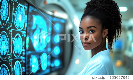 African American medical professional examining brain scan results on advanced digital display within cutting edge clinical research environment 135037043