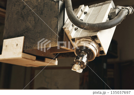 Cutting wood using a machine with numerical control. Cnc tool. Cutting wood using a machine with numerical control. Cnc tool. 135037697