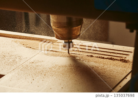 CNC router machine creates a layout of the shelf complex. 135037698