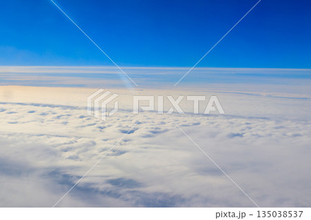Beautiful white clouds in blue sky. View from airplane 135038537