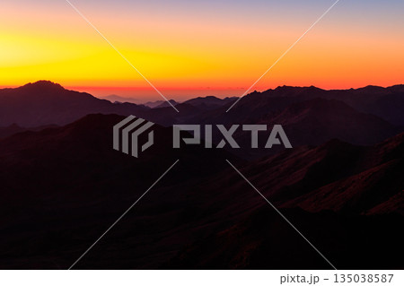 Beautiful sunrise on a top of Mount Sinai (Moses Mount) in Egypt Beautiful sunrise on a top of Mount Sinai (Moses Mount) in Egypt 135038587