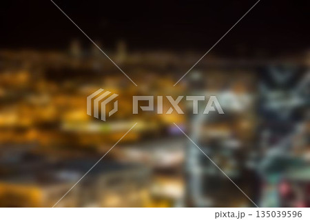 Illuminated crowded buildings in city 135039596