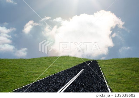 Asphalt road is climbing green grass hill in flat design, displaying dashed lines and clouds Asphalt road is climbing green grass hill in flat design, displaying dashed lines and clouds 135039602