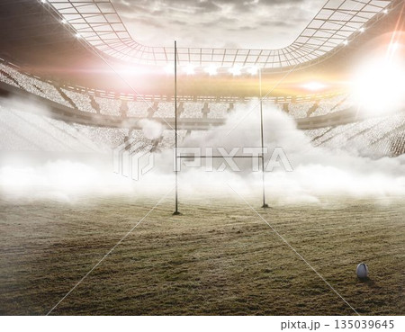 Flat design showing foggy rugby stadium with grass field, goalposts, rugby ball, floodlights 135039645
