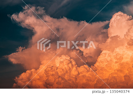 Dramatic orange sunset clouds and stormy sky Dramatic orange sunset clouds and stormy sky 135040374