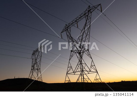 The evening electricity pylon silhouette The evening electricity pylon silhouette 135041114